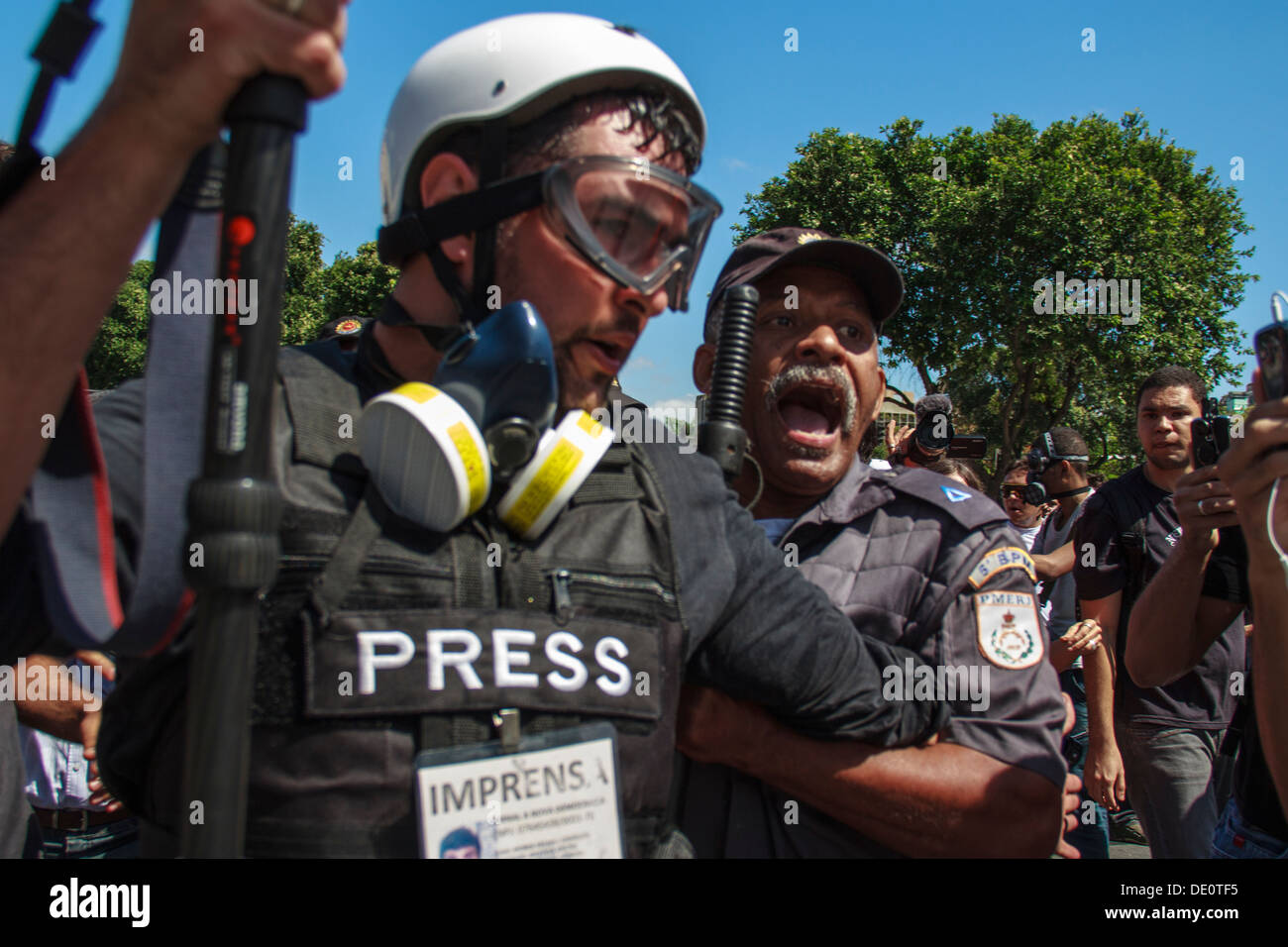 Independence of Brazil (September 7). Military Police holds film reporter during protest in Rio de Janeiro Stock Photo
