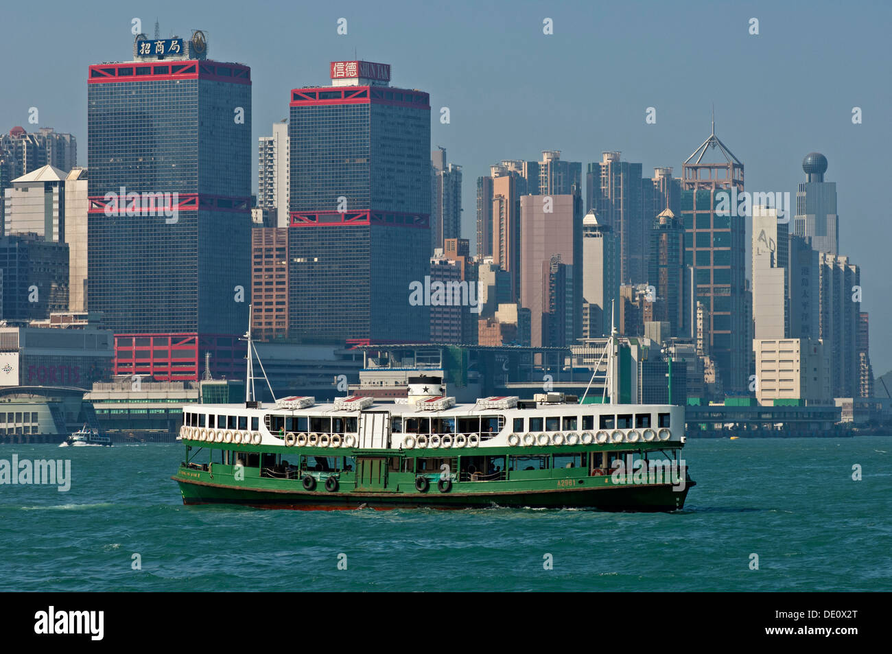 A Star Ferry carries passengers between Hong Kong Island and Kowloon across Victoria Harbour, Hong Kong Stock Photo