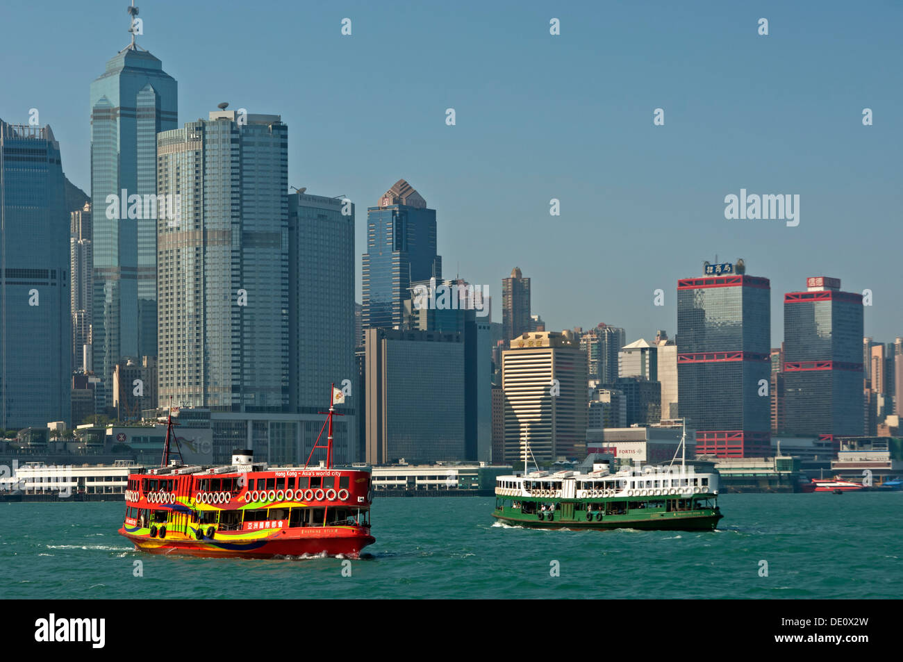 Star Ferries carry passengers between Hong Kong Island and Kowloon across Victoria Harbour, Hong Kong Stock Photo