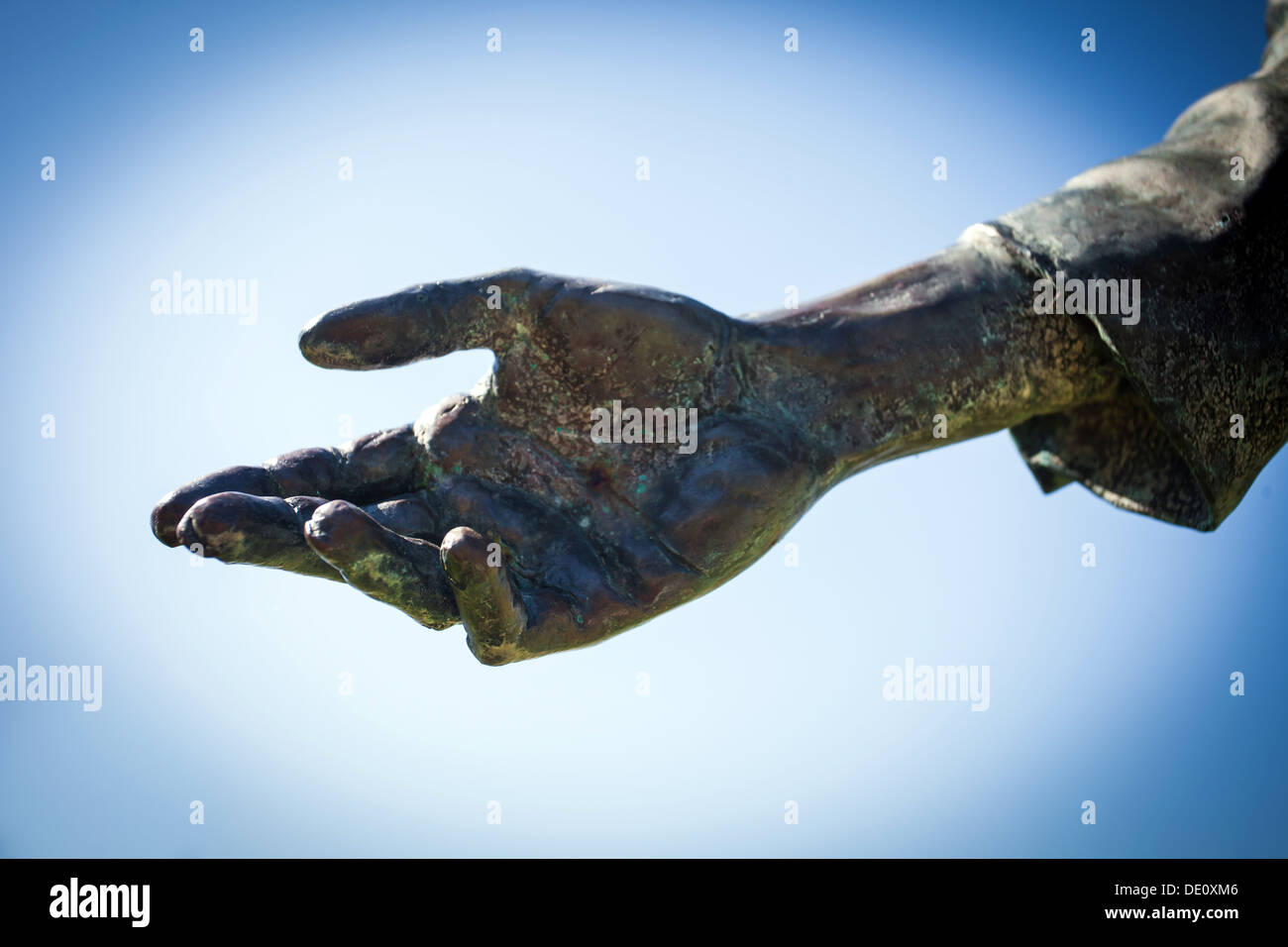 Open palm gesture of a bronze statue Stock Photo