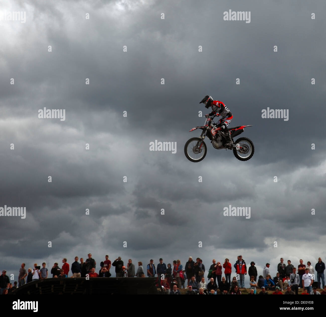 Freestyle Motocross or FMX stunt bike in the air. Stock Photo
