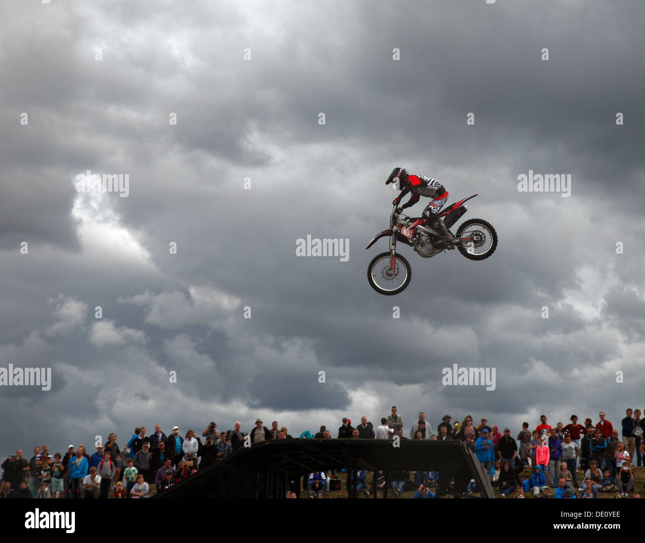 Freestyle Motocross or FMX stunt bike in the air. Stock Photo