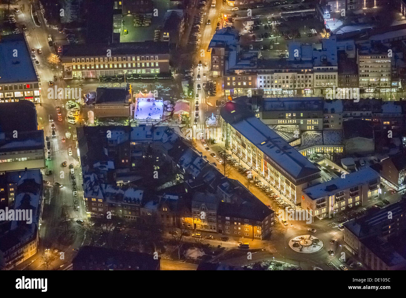 Aerial view, night shot, Berliner Tor gate with with ice rink, Berliner-Tor-Platz square Stock Photo