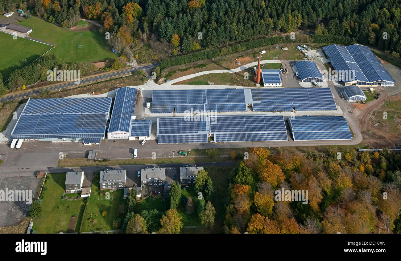 Aerial view, a factory with solar panels on the roof, Grafenwald industrial park, Hunsrueckhoehenstrasse scenic road Stock Photo