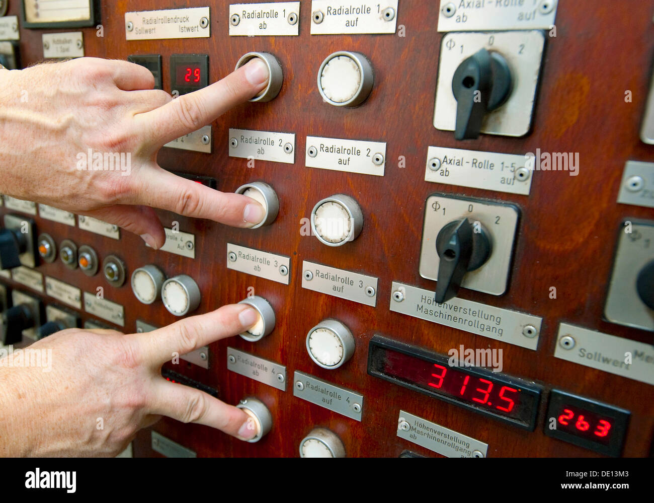 Four fingers pushing buttons, control system, mechanical processing, system control Stock Photo