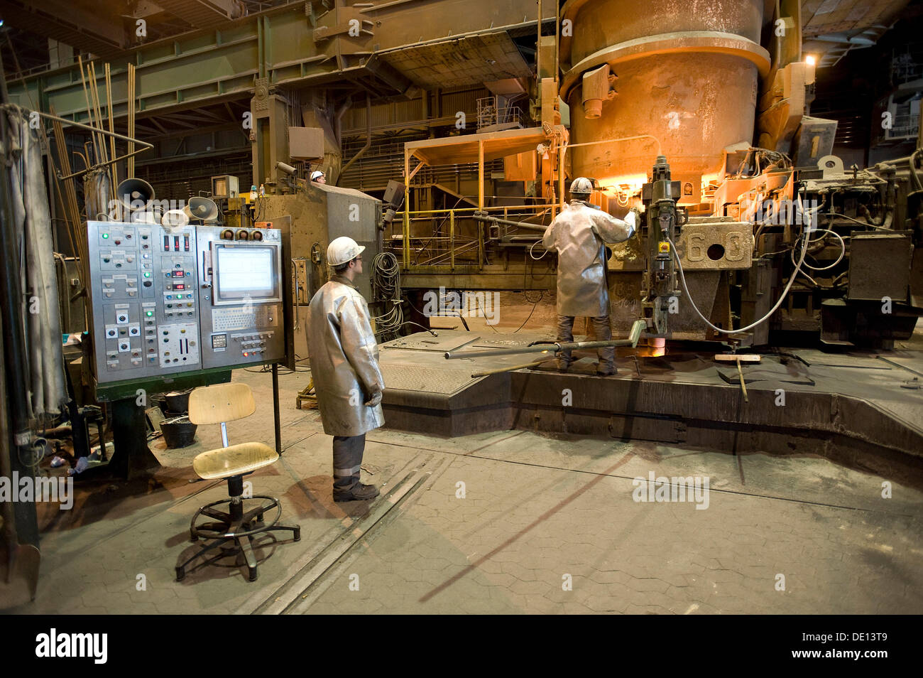 Liquid steel pouring from the ladle into the casting, casting plant