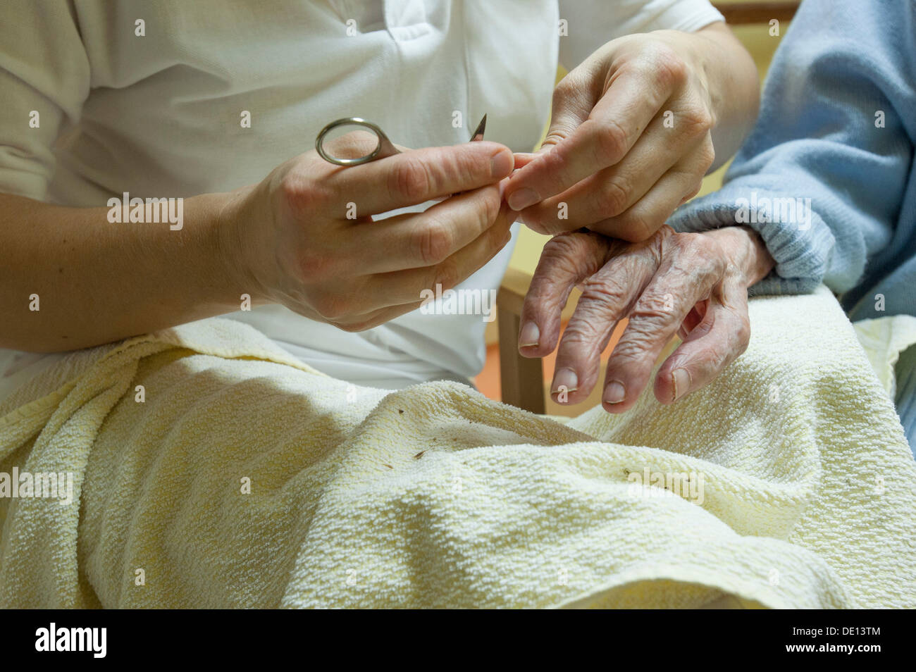 Cutting fingernails old person hires stock photography and images Alamy