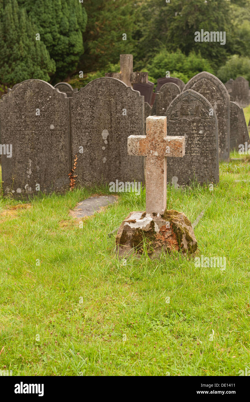 Rows of weathered natural slate headstones making for a grey feel and