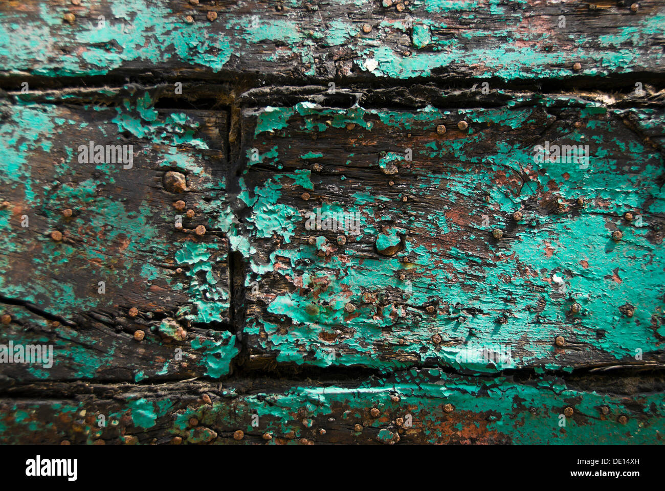 Weathered wooden boards with fragments of green paint Stock Photo