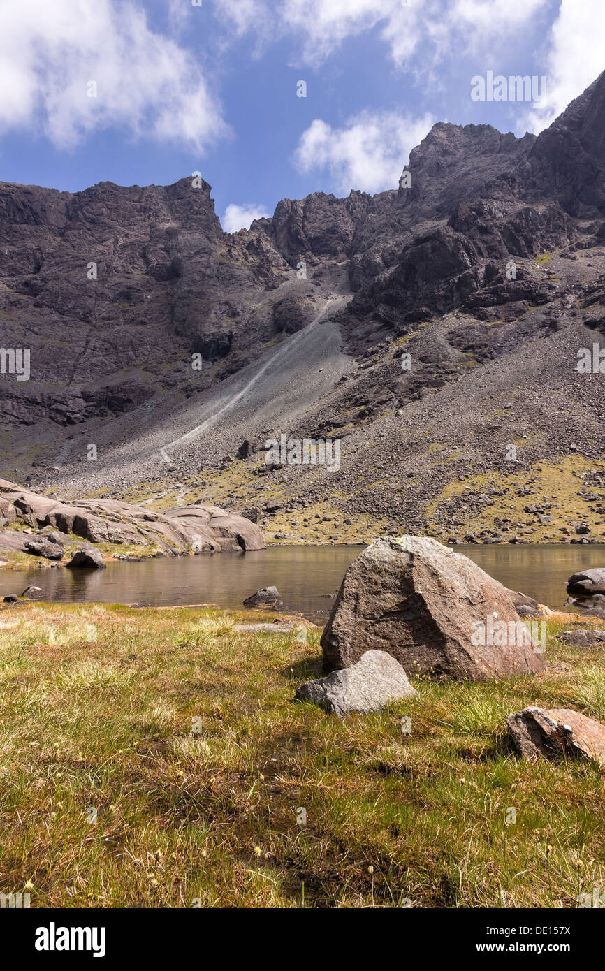 Glaciated corrie and lake of Coire Lagan high in the Black Cuillin Mountains, Glenbrittle, Isle of Skye, Scotland, UK Stock Photo