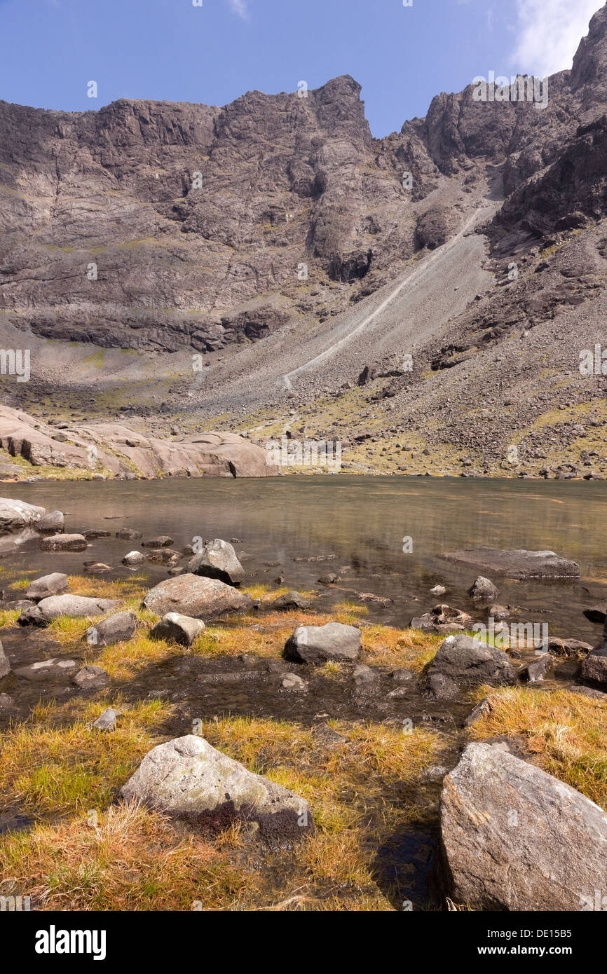 Glaciated corrie and lake of Coire Lagan high in the Black Cuillin Mountains, Glenbrittle, Isle of Skye, Scotland, UK Stock Photo