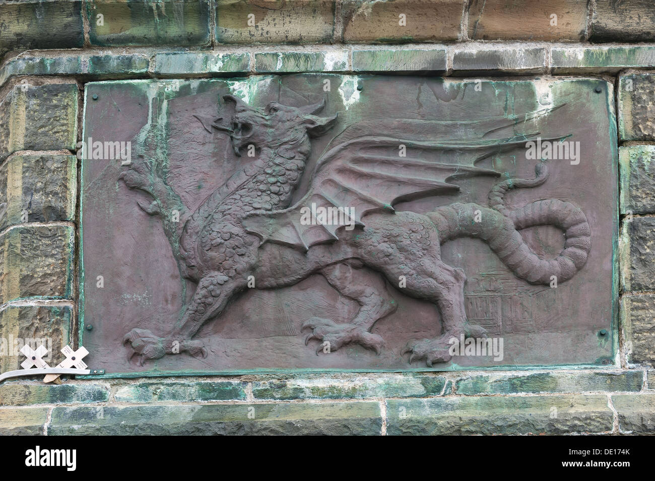 Cast bronze Welsh Dragon symbol for Wales showing signs of weathering