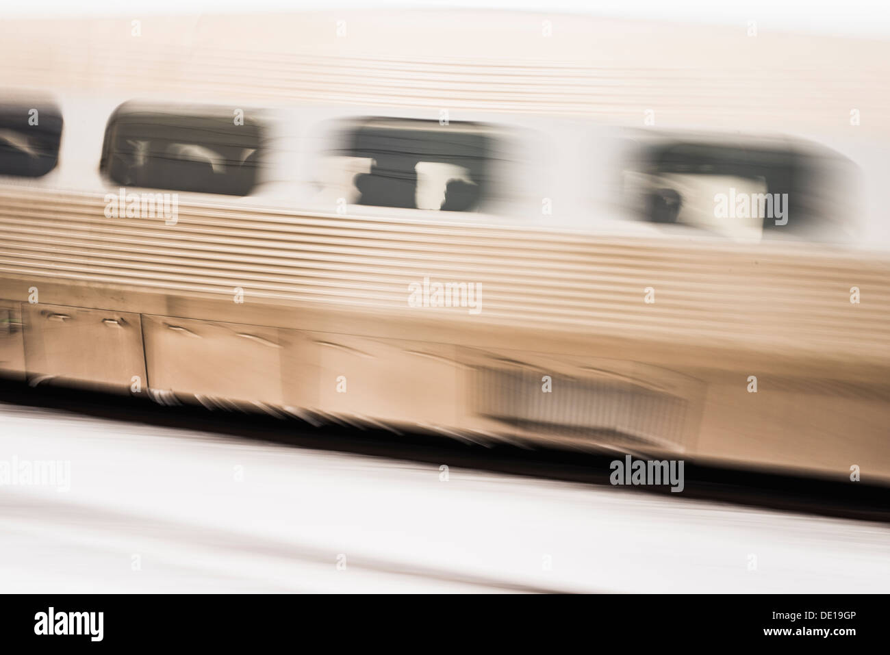 Blurred motion of train with passengers at winter in Stockholm, Sweden Stock Photo