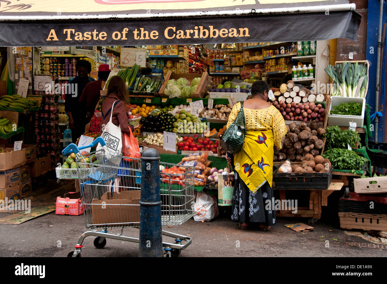 Brixton Market shops and stalls with multicultural fruit and veg Stock
