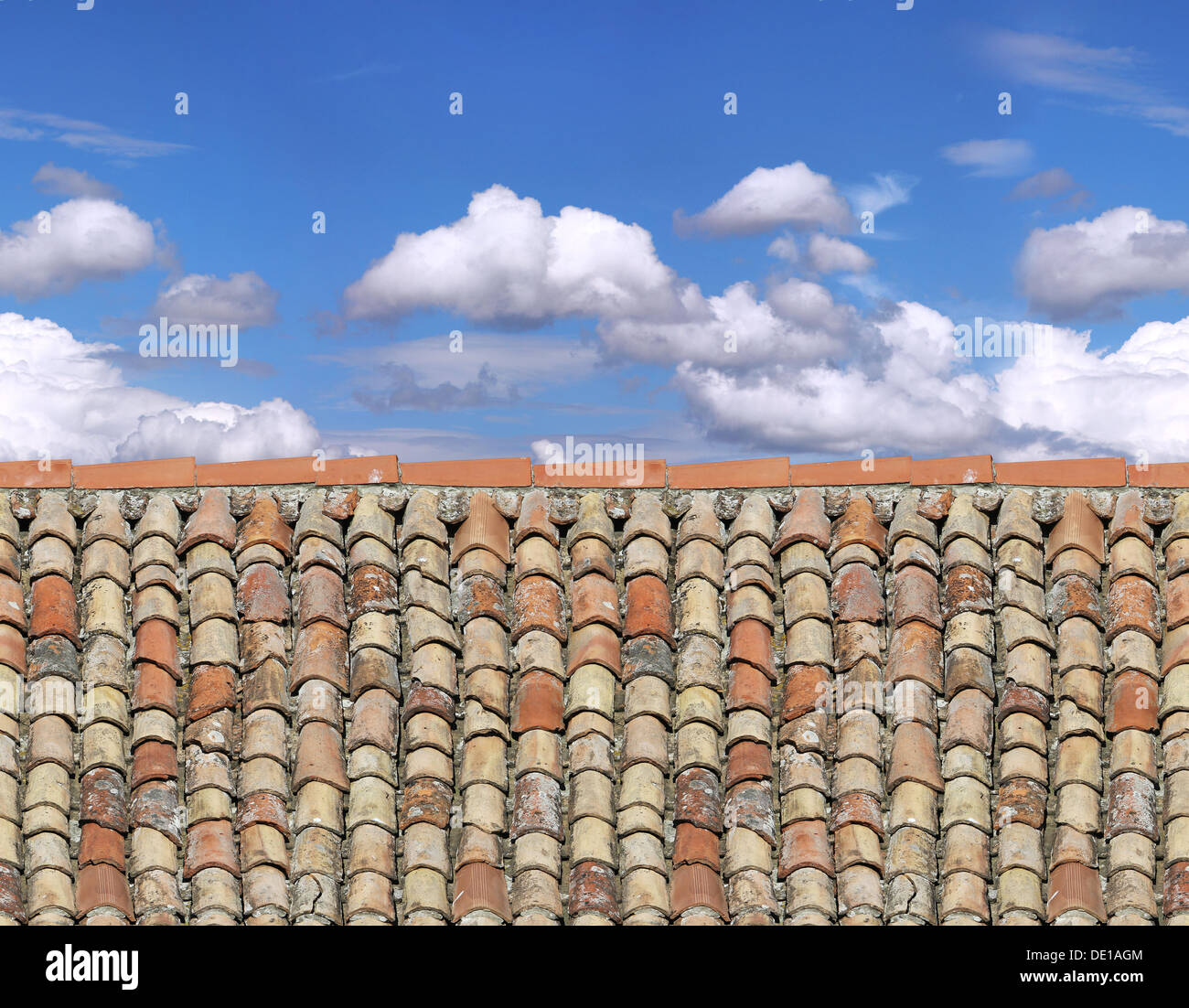 Old roof tiles, sky and clouds as seamless pattern Stock Photo