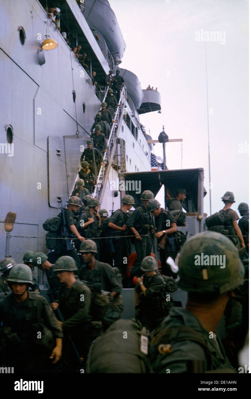 Vietnam War 1957 - 1975, arrival of American soldiers, changing into a landing craft, South Vietnam, 1965, harbour, harbor, harbours, harbors, port, ports, transport ship, transport ships, boat, boats, military, armed forces, army, armies, USA, United States of America, South-East Asia, South East Asia, Southeast Asia, Far East, Viet Nam conflict, Viet Nam, Vietnam, war, wars, conflict, conflicts, 1960s, 60s, 20th century, people, men, man, male, soldiers, soldier, landing craft, landing crafts, historic, historical, Additional-Rights-Clearences-Not Available Stock Photo