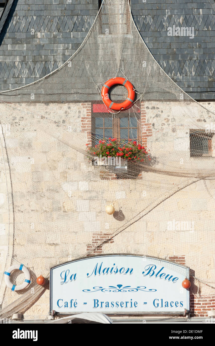 The sign for the Maison Bleue and wall decorated withat  Honfleur Normandy France Stock Photo