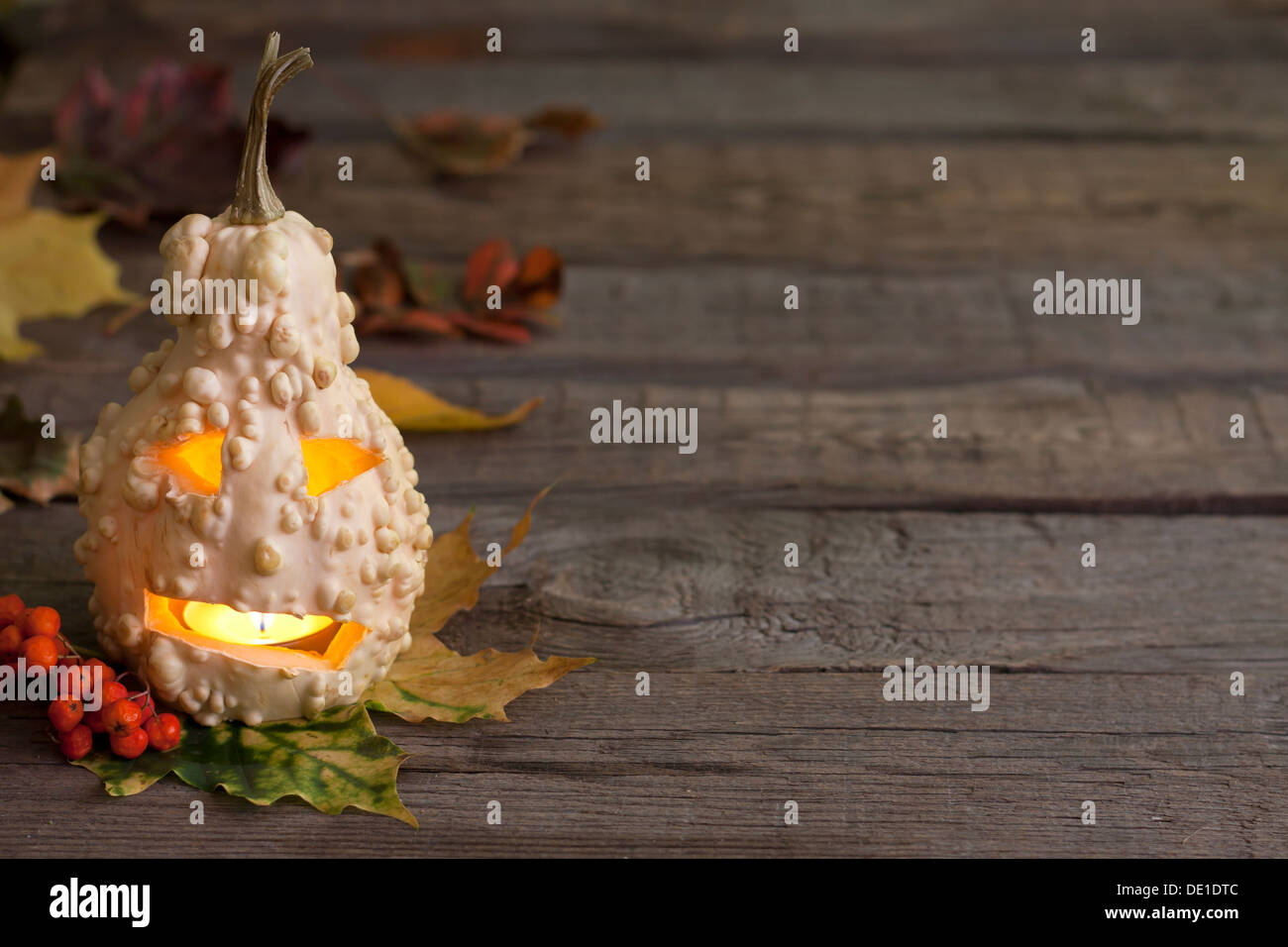 Autumn abstract background with halloween pumpkin on wooden boards Stock Photo