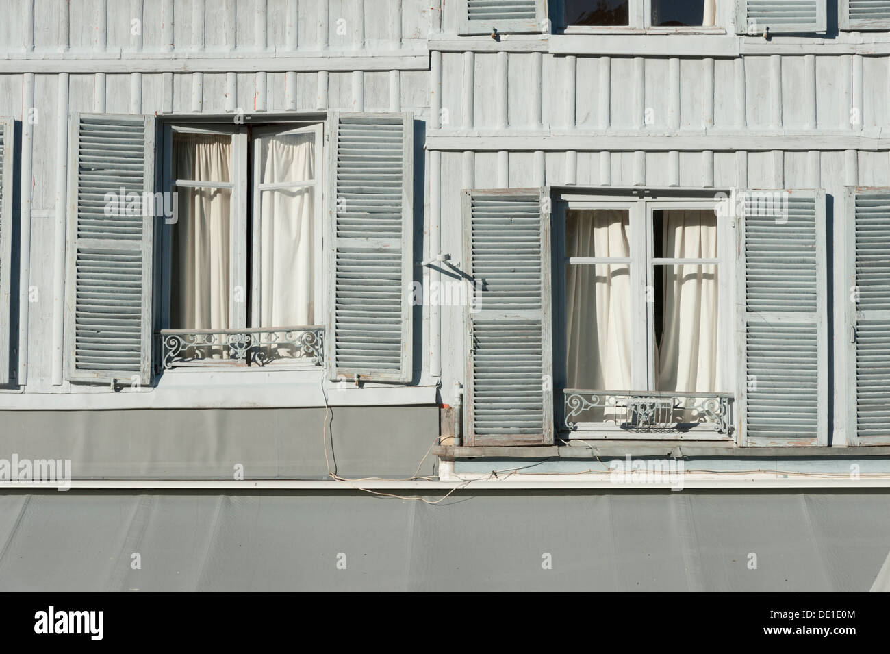 Grey french windows with shutters in France Stock Photo