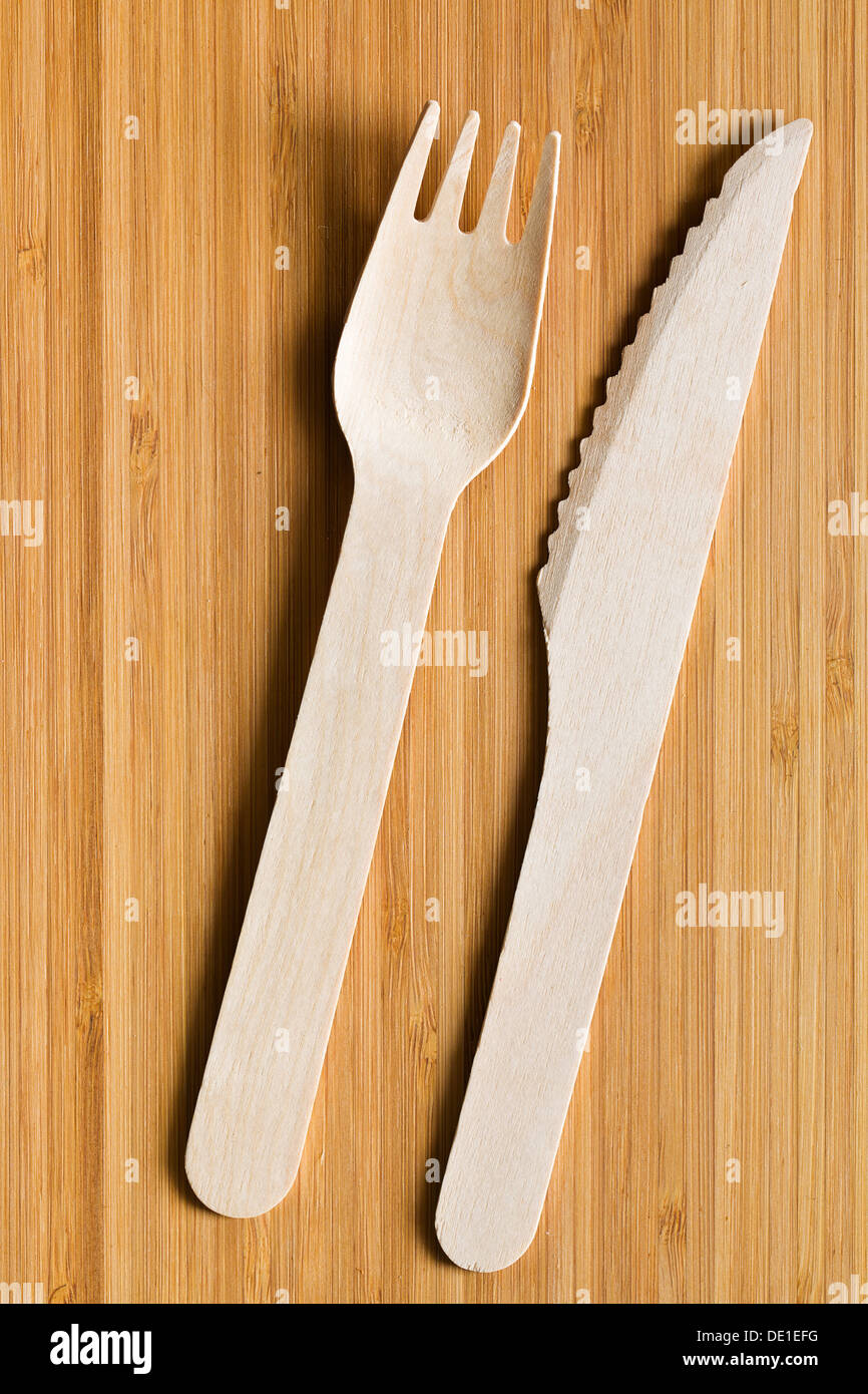 set of wooden cutlery on wooden table Stock Photo