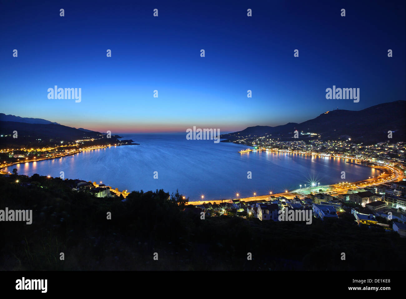 Panoramic night view of Samos town ('Vathi'), Samos island, Aegean Sea, Greece. Stock Photo