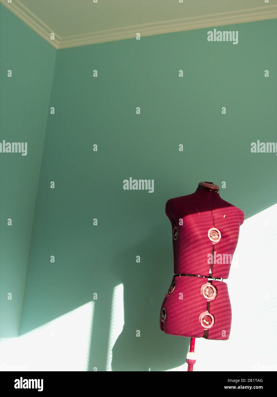 Dress makers dummy lit by bright sunshine Stock Photo Alamy