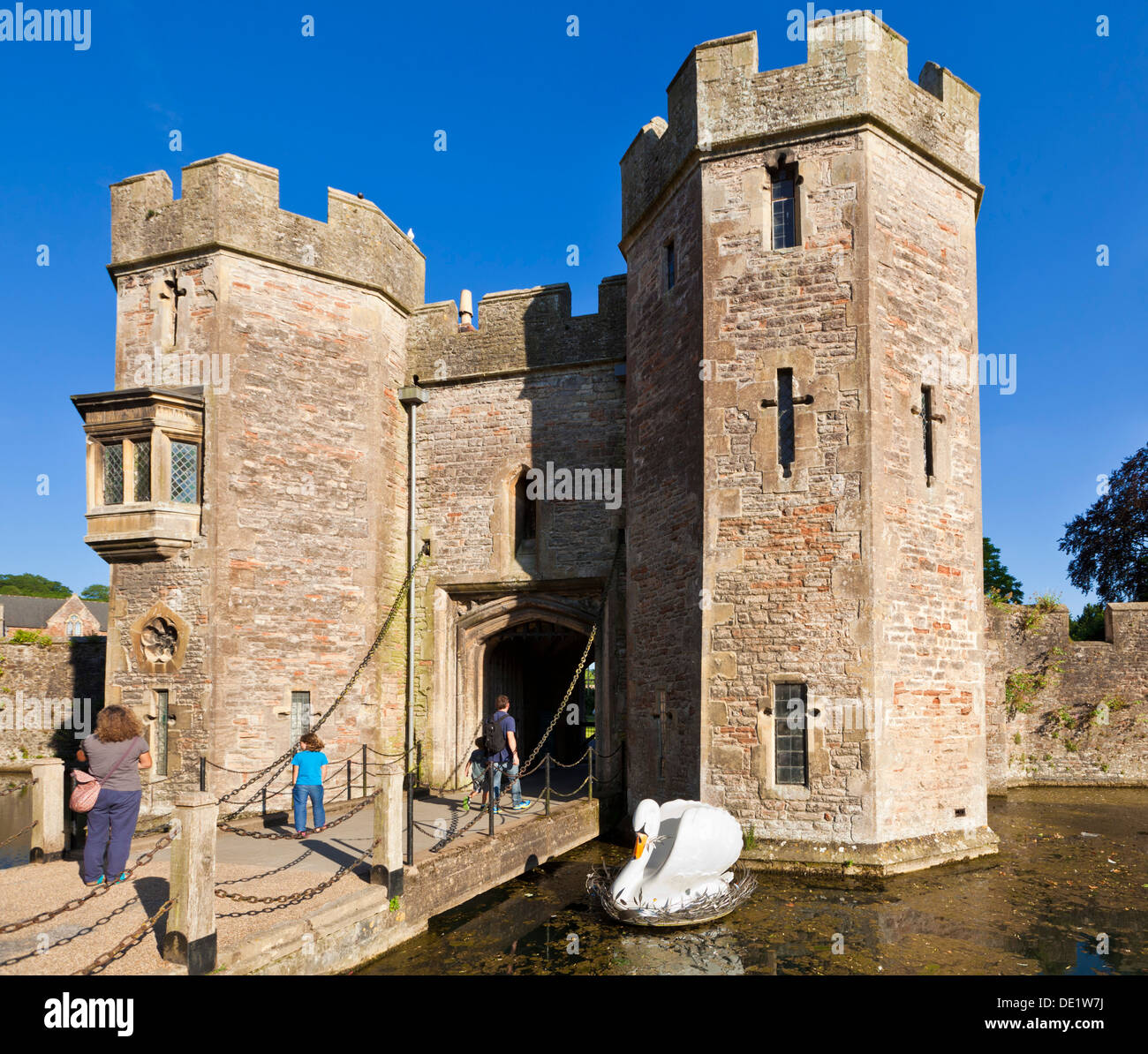 Bishop's Palace and moat with large model swan floating on it Wells Somerset England uk gb eu Europe Stock Photo