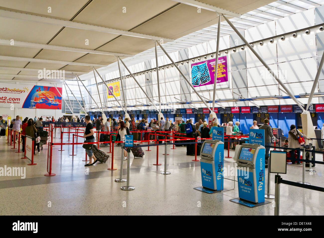East Midlands airport check in lines to desks area Castle Donnington Derbyshire England UK GB EU Europe Stock Photo