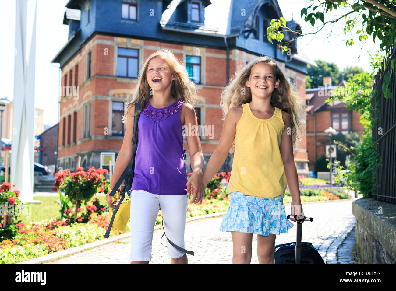 two teenage girls on the way to school Stock Photo - Alamy