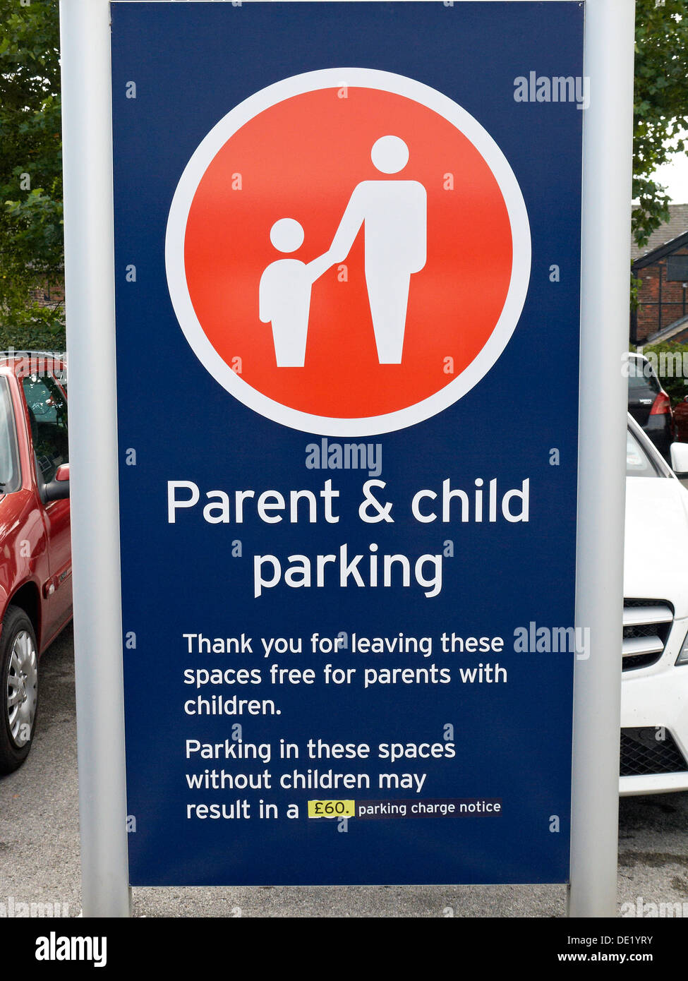 Supermarket parent & child parking sign with warning UK Stock Photo