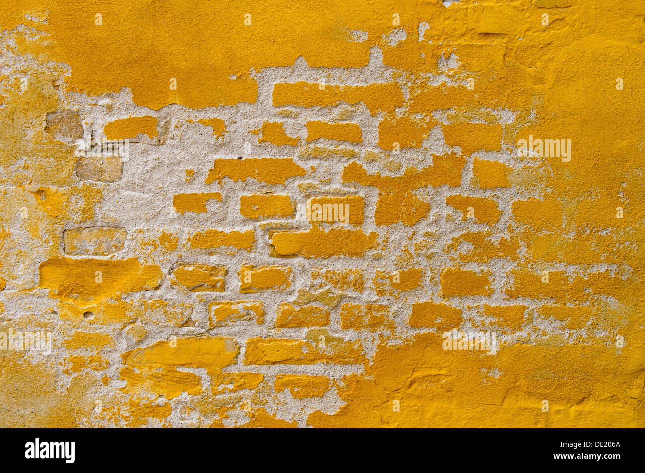 Ochre yellow brick wall Stock Photo