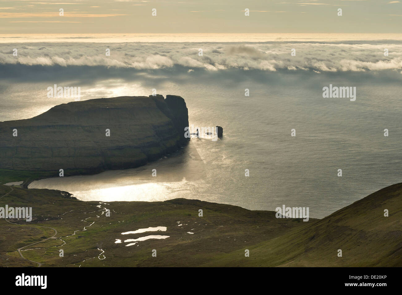 Kollur Mountain and the sea stacks of Risin and Kellingin in the evening light, Eiði, Eysturoy, Faroe Islands, Denmark Stock Photo