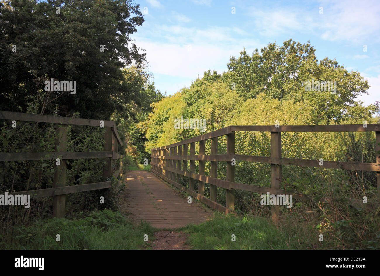 A bridge for walkers and ramblers on the Weavers Way long distance footpath at Honing, Norfolk, England, United Kingdom. Stock Photo