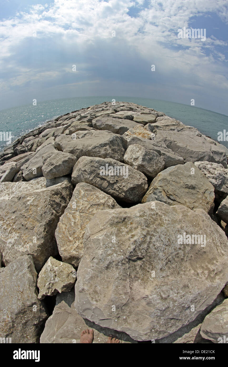 very picturesque seaside rocks and breakwaters photographed with the fisheye lens Stock Photo