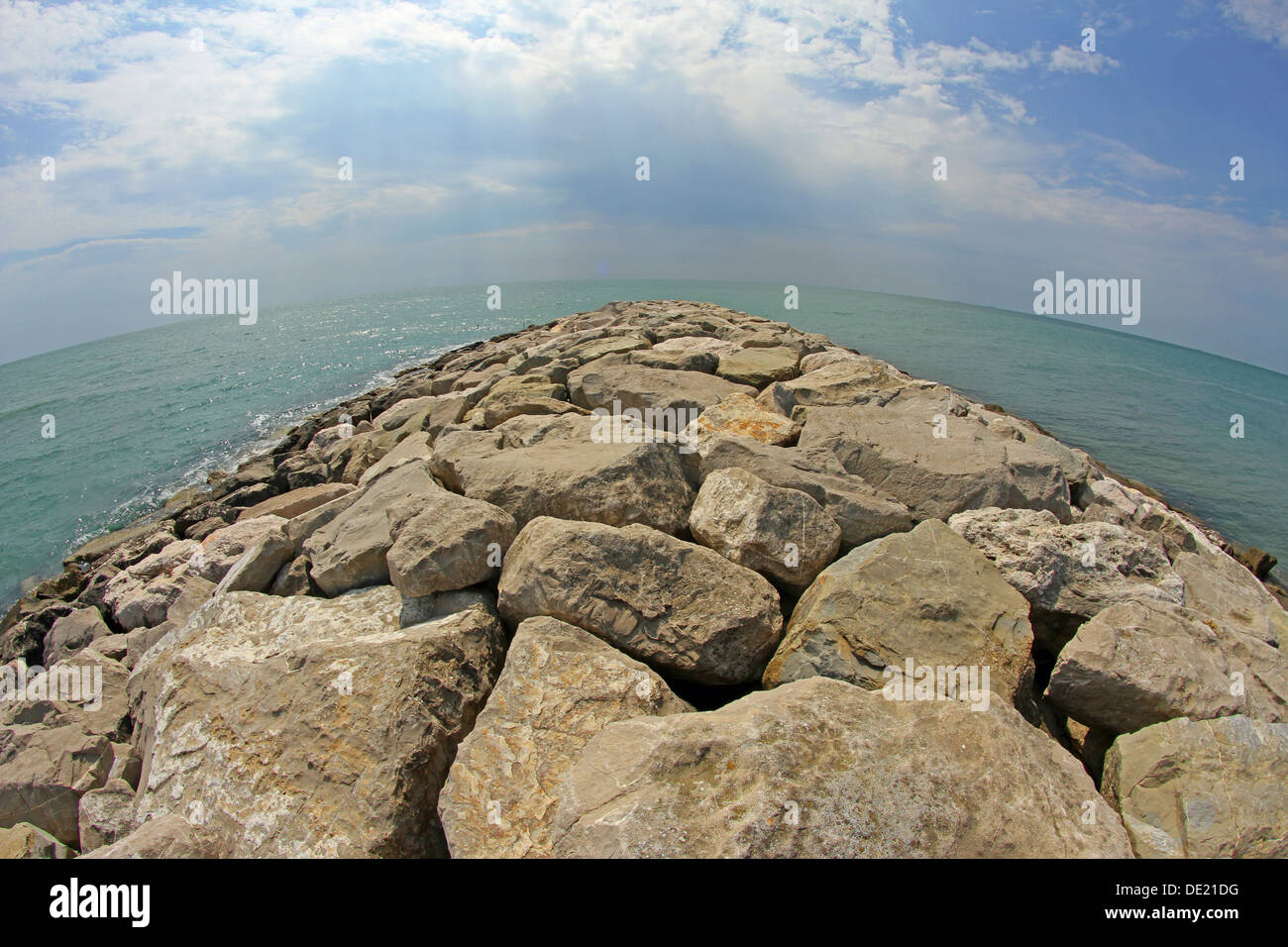 picturesque seaside rocks and breakwaters photographed with the fisheye lens Stock Photo