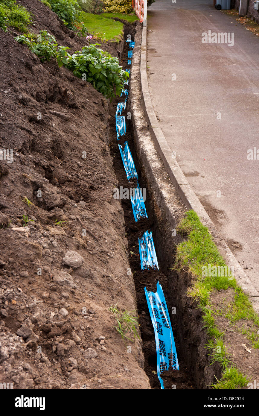 self building house, Blue Caution Water Main Below warning tape above