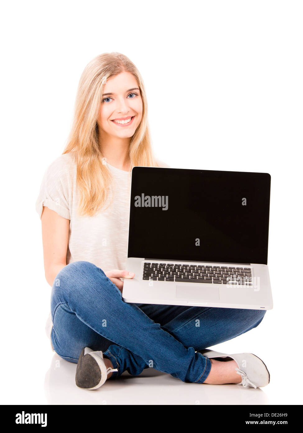 Beautiful and happy woman working with a laptop, isolated over white ...