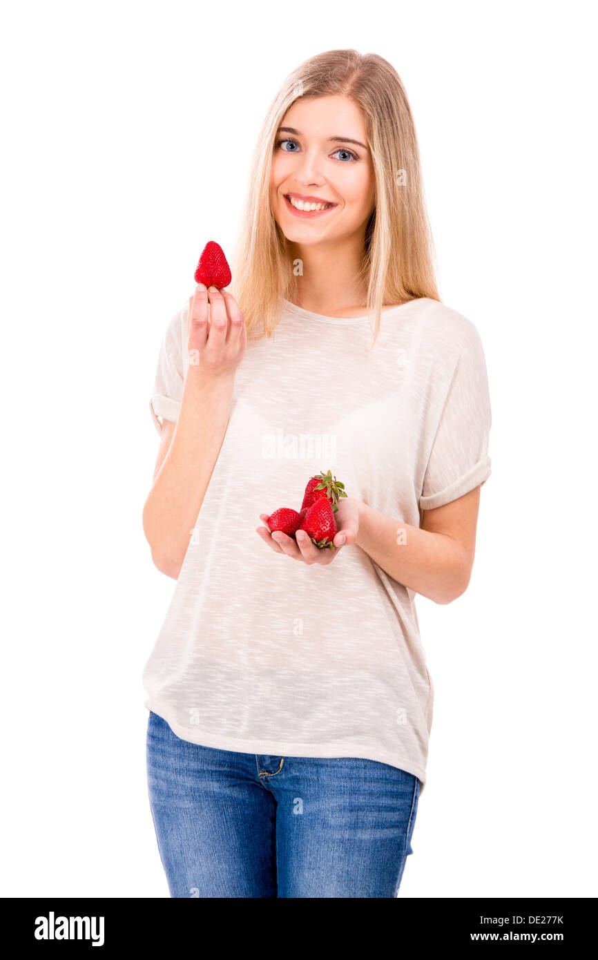 Beautiful blond woman smiling and holding strawberries, isolated over white background Stock Photo