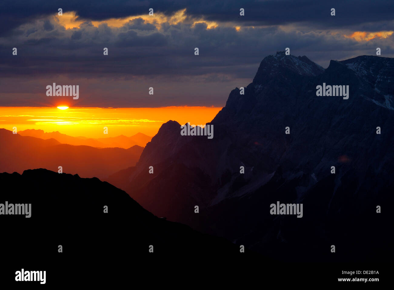 Sunrise behind Zugspitze Mountain with staggered mountain peaks, Berwang, Ausserfern, Tyrol, Austria, Europe Stock Photo