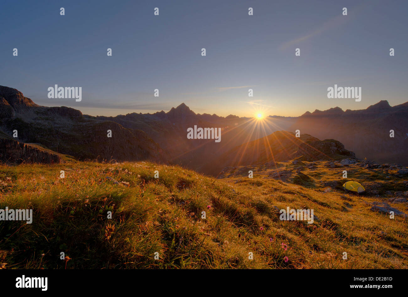 Sunrise with ridge and bivouac tent, Hinterhornbach, Lechtal, Ausserfern, Tyrol, Austria, Europe Stock Photo