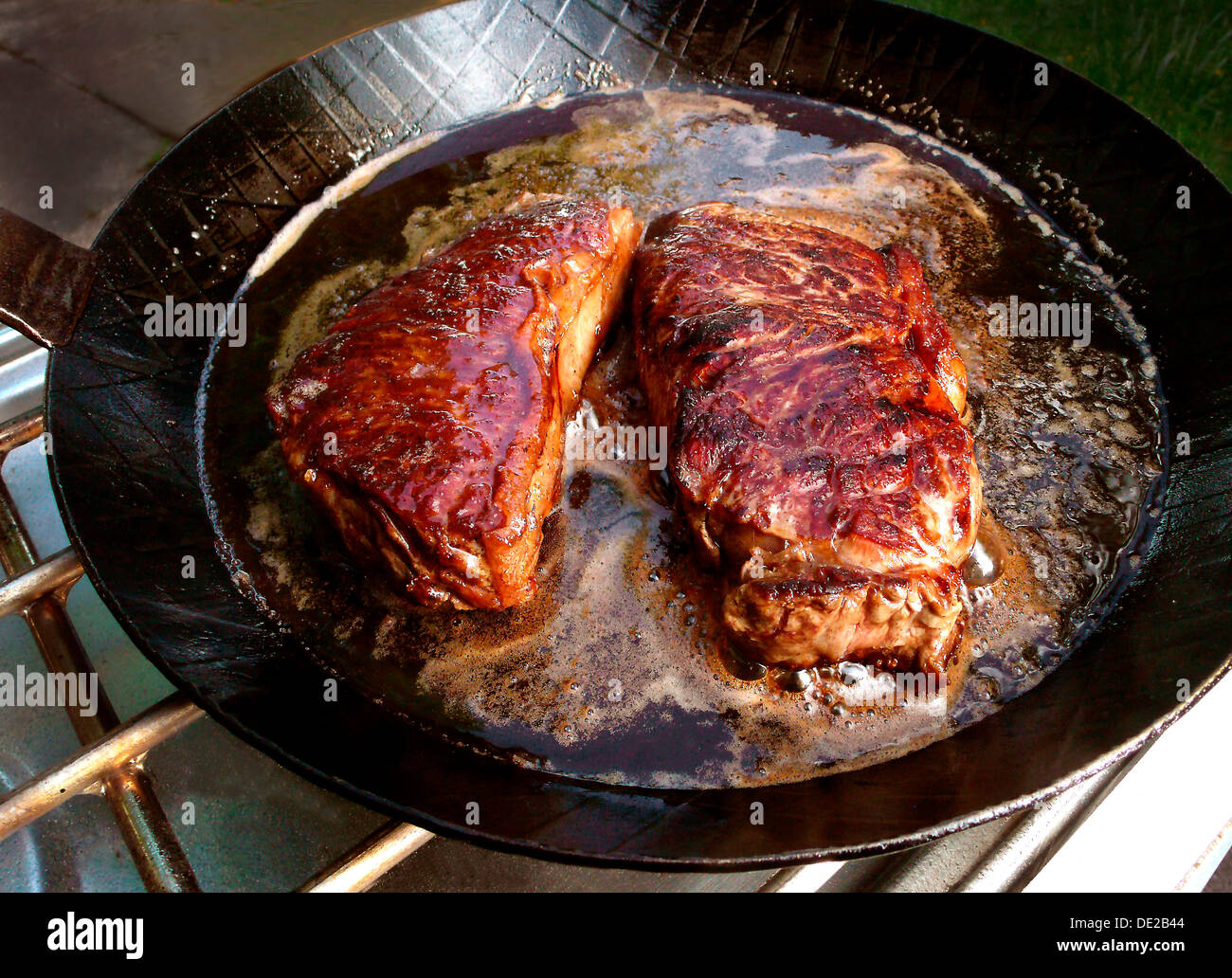 Fried steaks in a pan, Germany Stock Photo