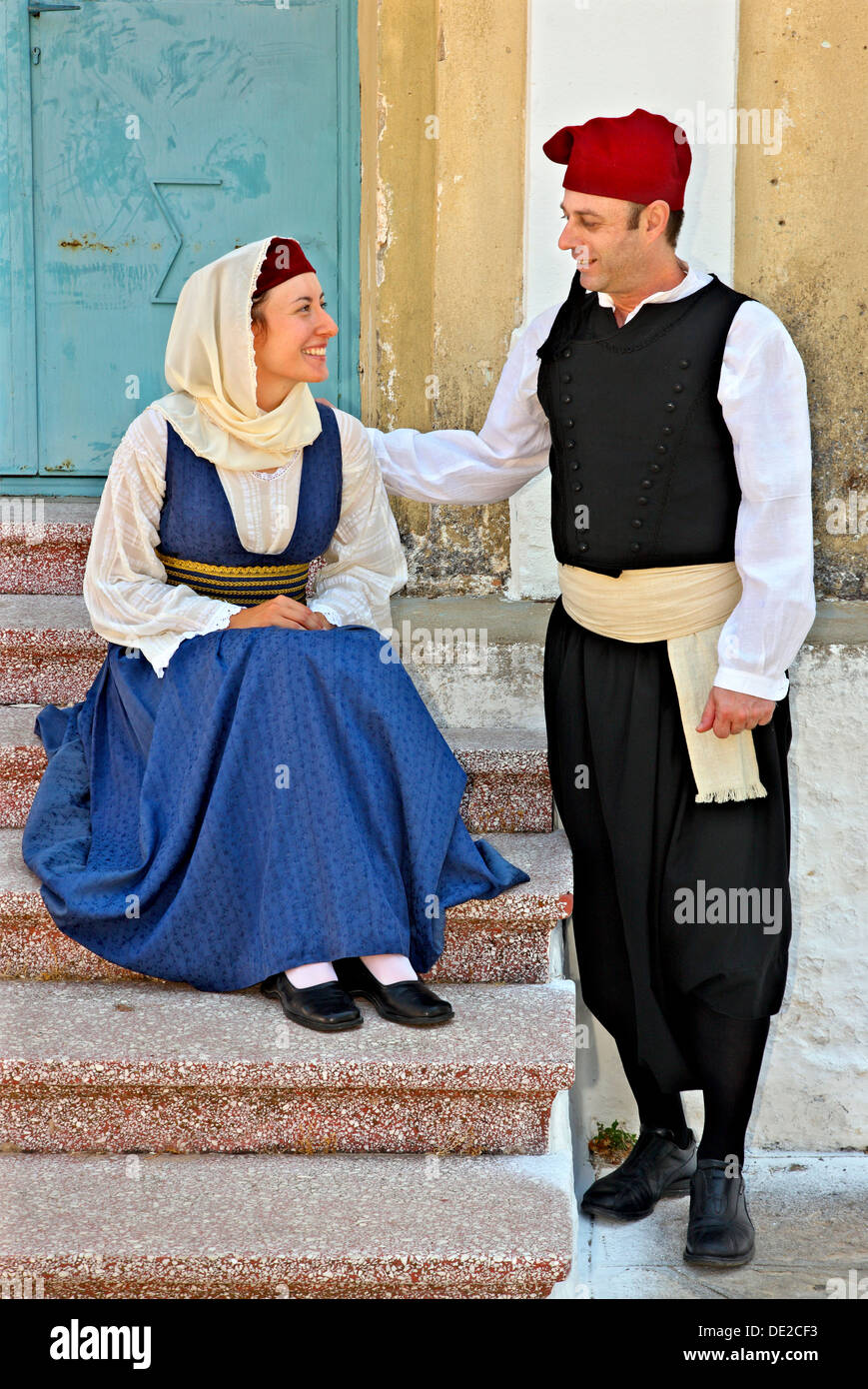 Young couple wearing traditional costumes in Palaio ('old') Karlovasi, Samos island, Greece. Stock Photo