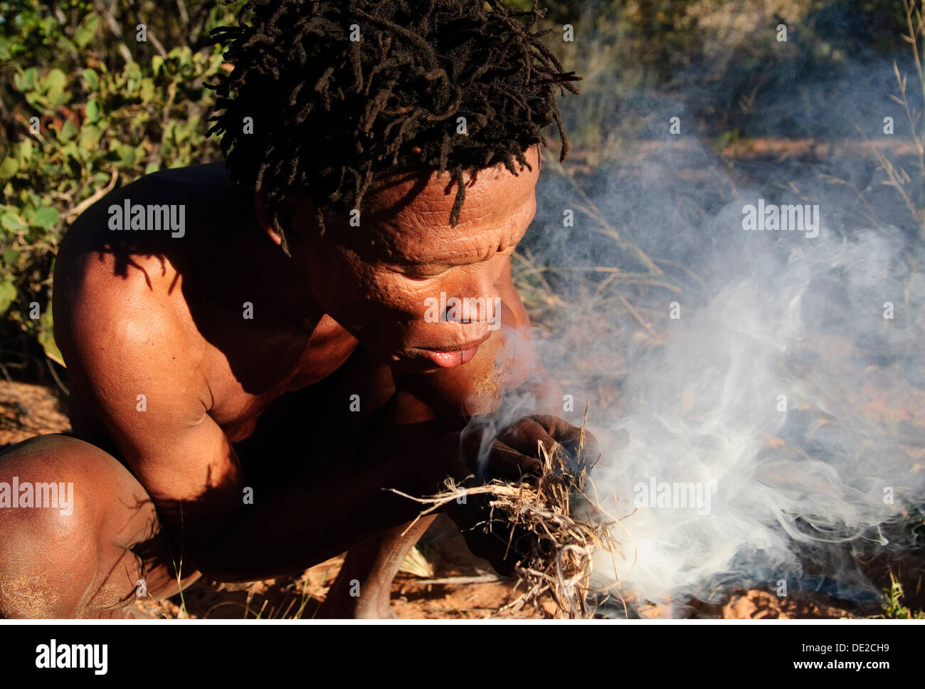 fire, Bushman is making a fire, Living museum near Grashoek, Namibia ...