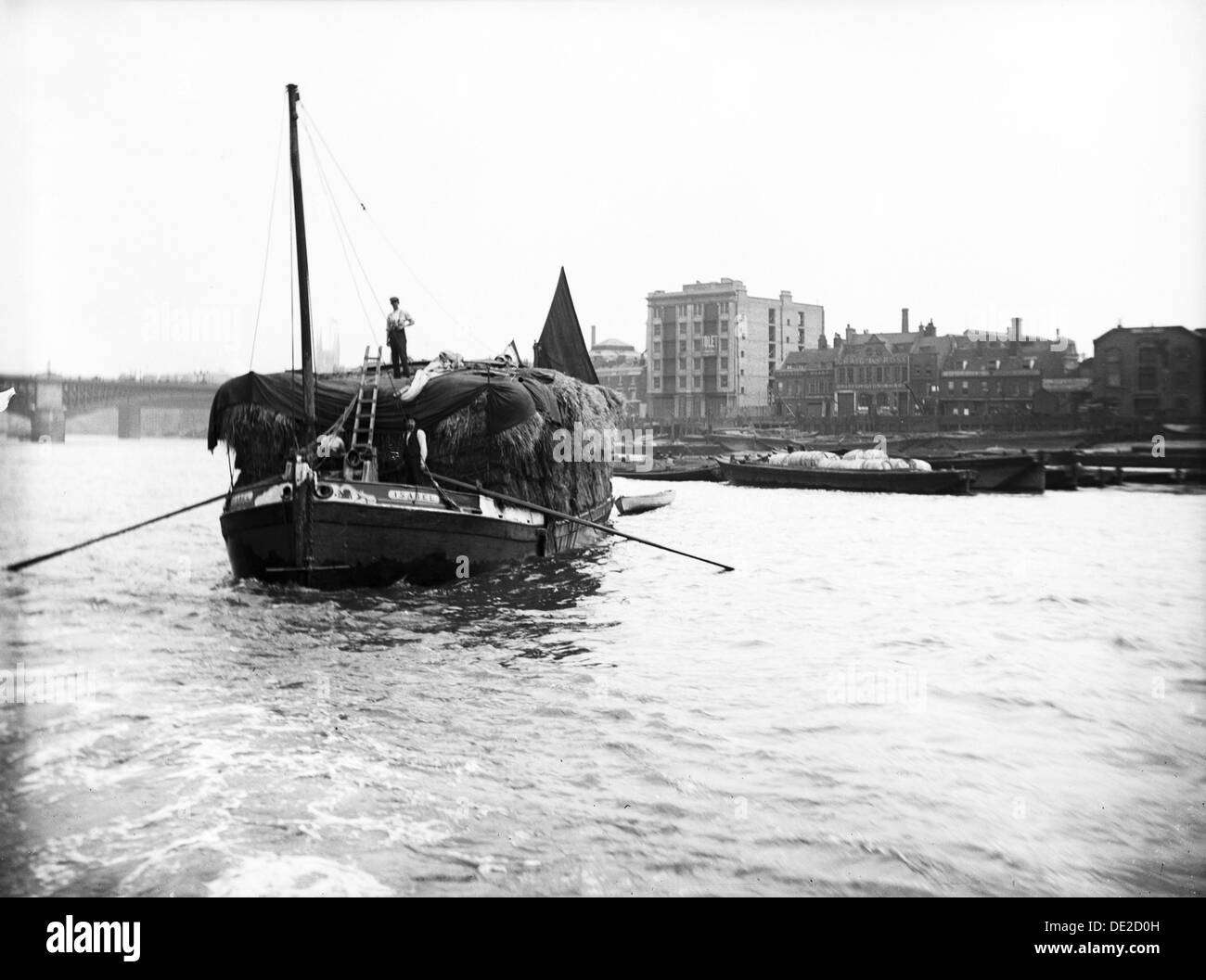 Dumpy barge on the Thames loaded with hay or esparto, London, c1905. Artist: Unknown Stock Photo