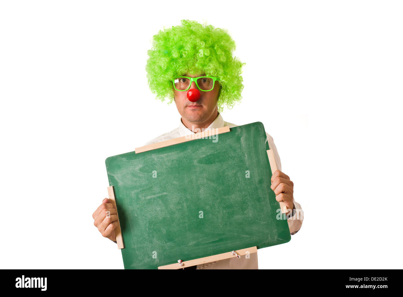 Clown holding chalkboard on white background. Stock Photo