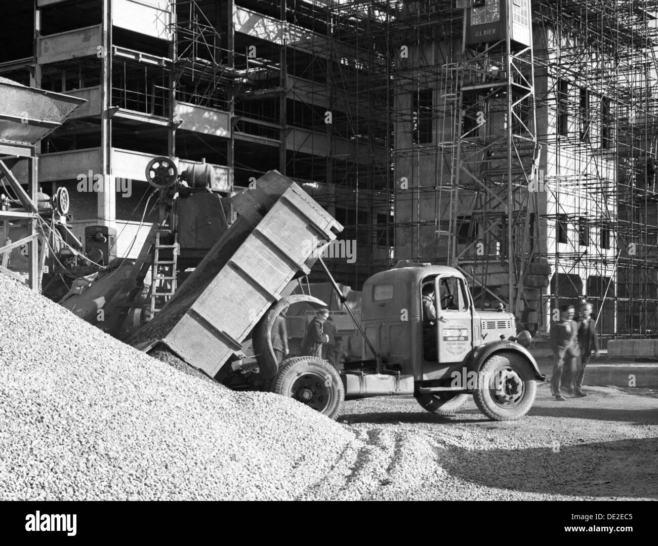 Early 1950s Bedford M Tipper delivering aggregates to a building site, South Yorkshire, July 1954. Artist: Michael Walters Stock Photo