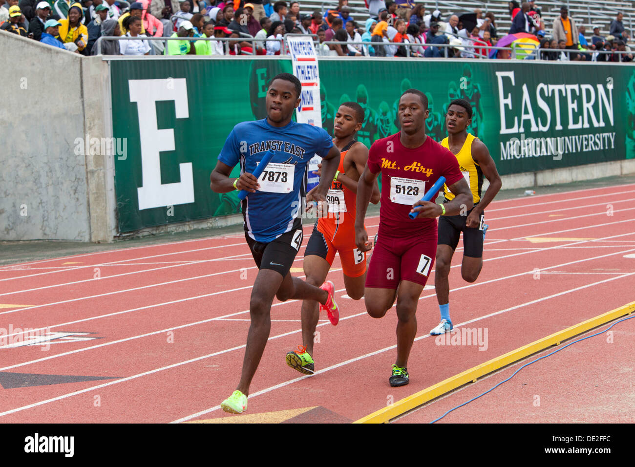 Ypsilanti, Michigan - Relay race competition during the track and field events at the AAU Junior Olympic Games. Stock Photo