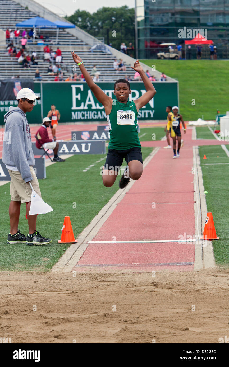 Ypsilanti, Michigan - Boys long jump competition during the track and field events at the AAU Junior Olympic Games. Stock Photo