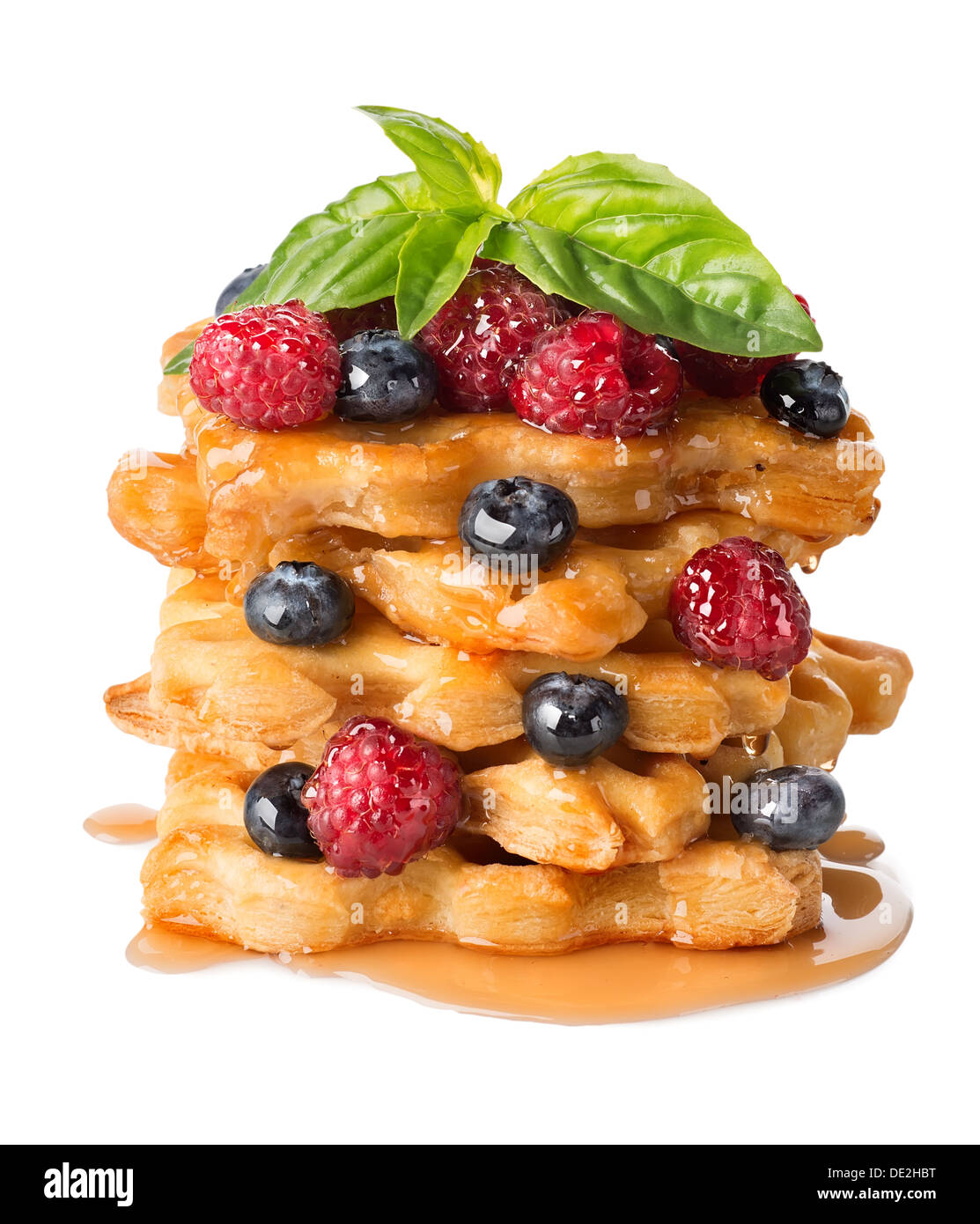 Pyramid of puff pastry with berries isolated on white Stock Photo