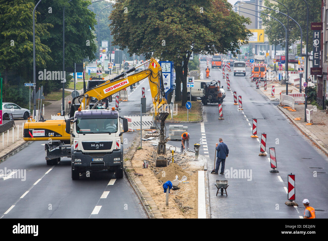 Innercity road construction site. Asphalted work on a major road